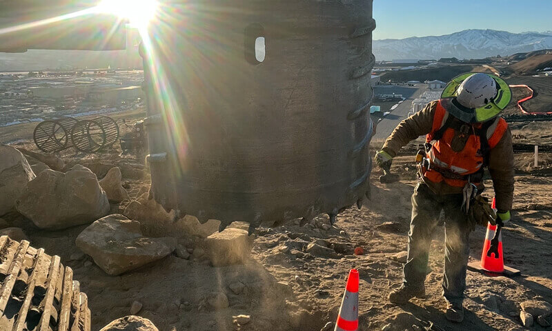 Sunset dig into tough ground with a heavy duty machine.