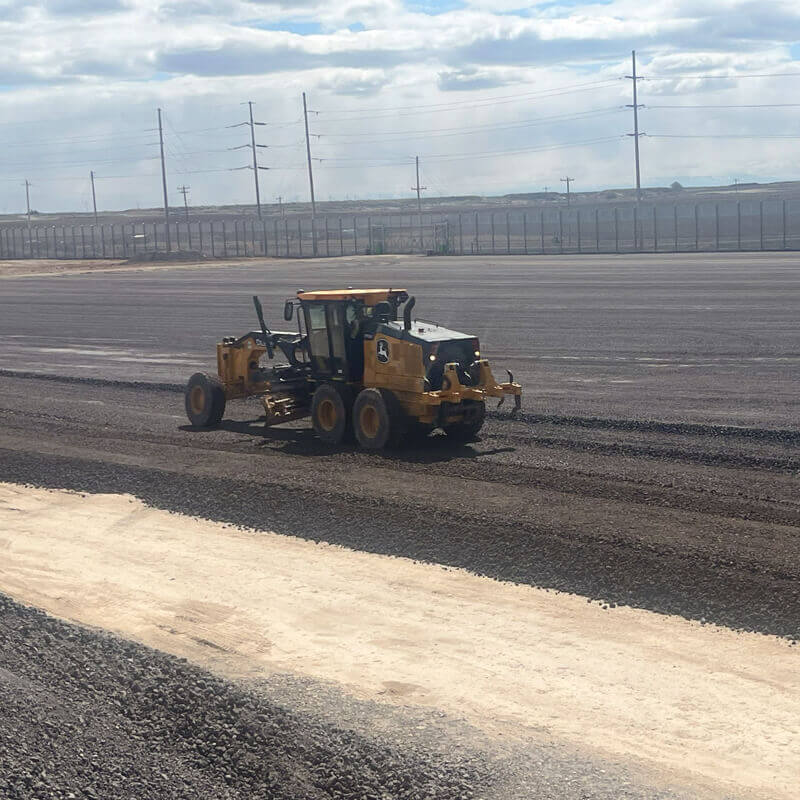 Alpine Drilling completing roadwork with fresh tarmac.